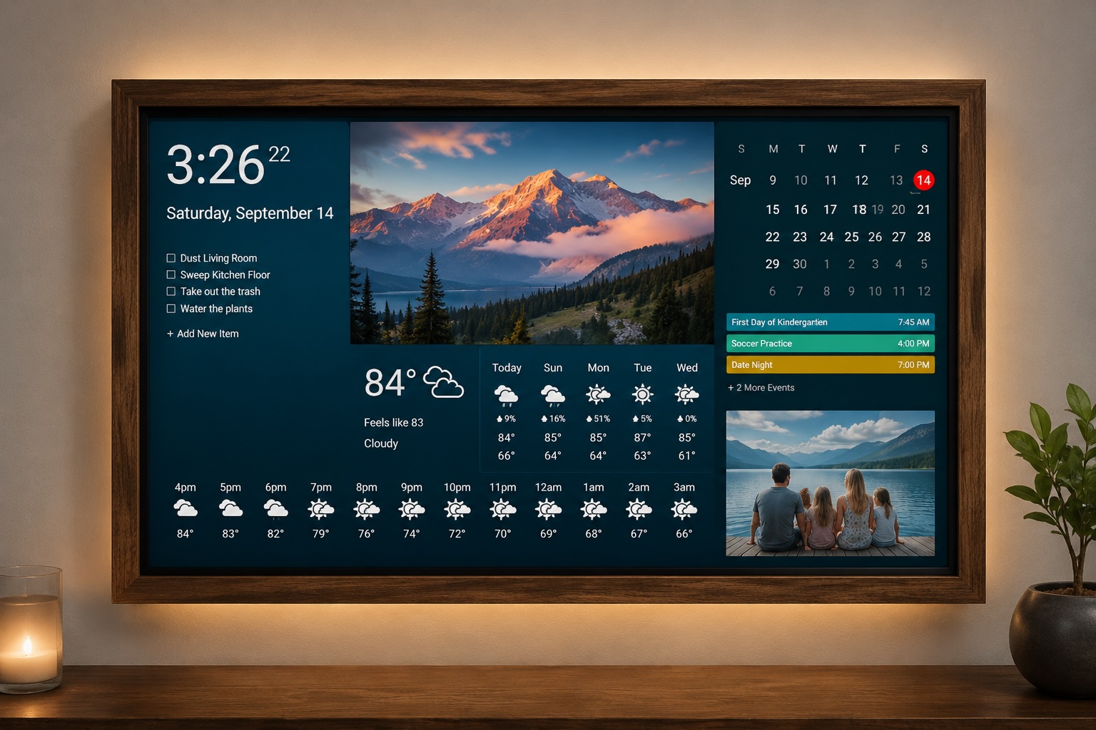 A wall-mounted DAKboard display showing personal photos alongside the clock, weather, calendar, and to-do widgets in a cozy living room
